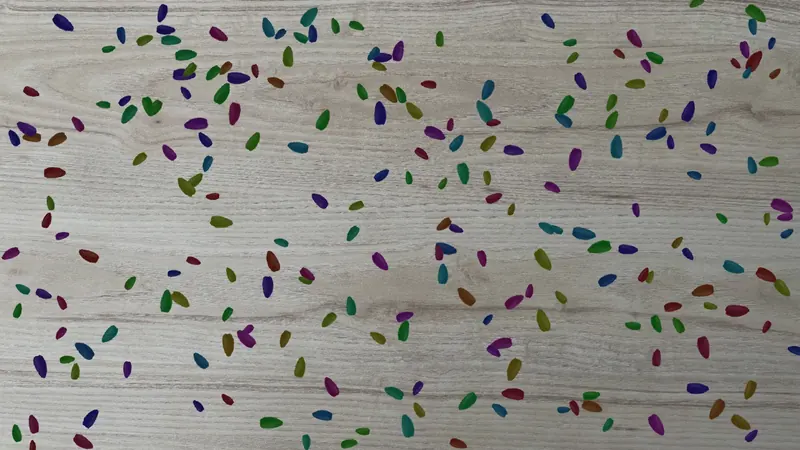 Generated image of seeds on a wooden surface, with an instance mask for each seed