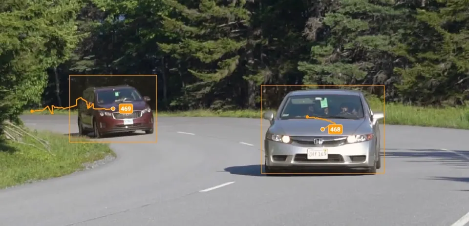 Trajectories of two tracked cars on a road, each following its own car
